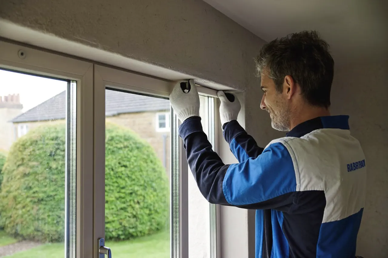 Technician inspecting the seal on a glazing unit