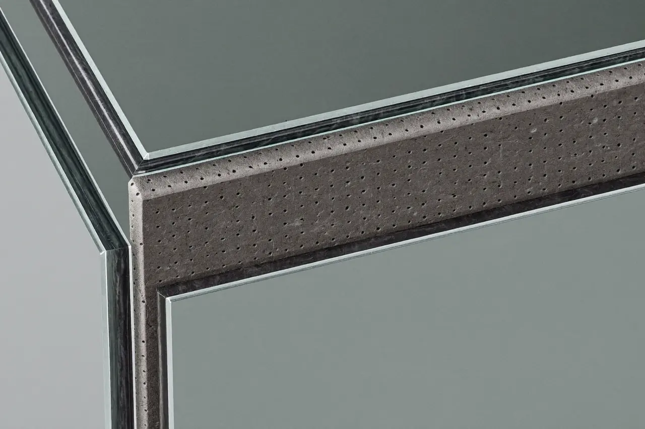 Close detail of a warm edge spacer bar around a sealed unit edge